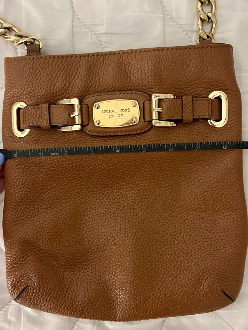 Michael Kors features 	•	genuine
